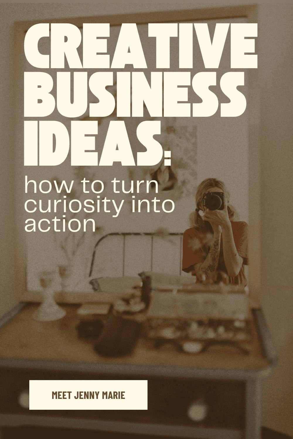 A minimalist, intentional workspace showing a camera and woman representing the early ideation phase of building an aligned creative business.